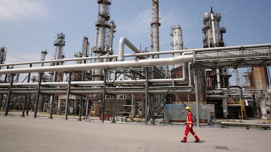 Shell Sarnia worker walks by the fluidised catalytic cracking unit