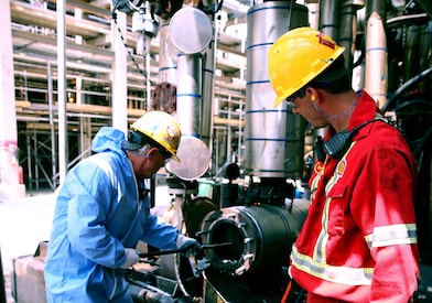 Shell Sarnia workers clean a suction screen used in residue upgrading