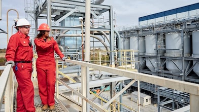 Two men standing on construction site