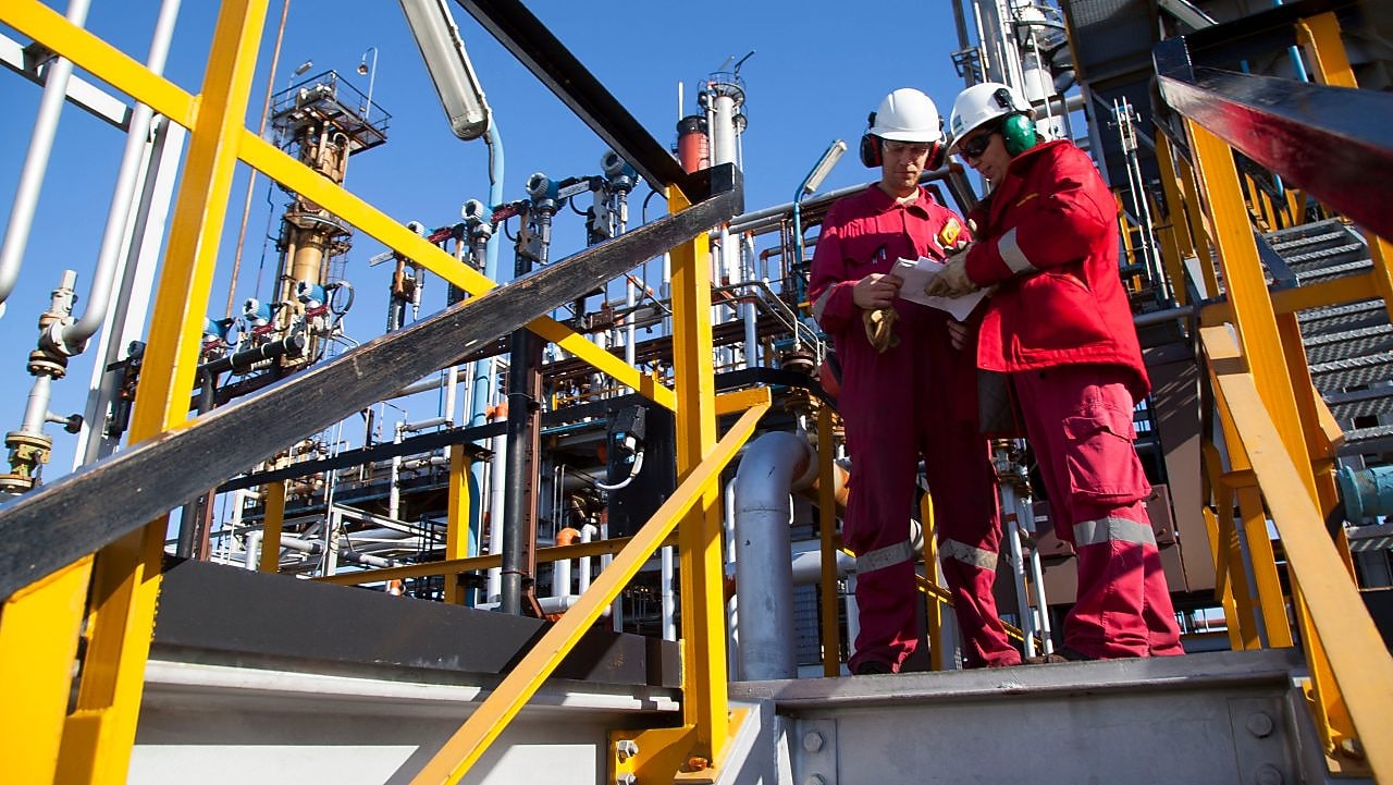 Two shell workers at the site