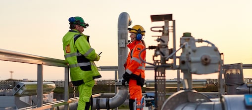 Frontline staff talking  at the Nyhamna gas  processing plant in Norway