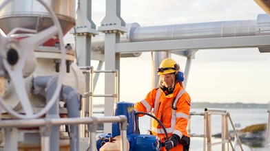 Female frontline worker looking at equipment at the Nyhamna Gas Plant