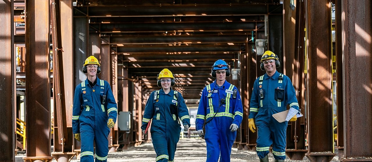 Shell employees discussing with each other