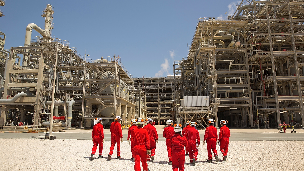 Shell employees walking at the Pearl GTL facility