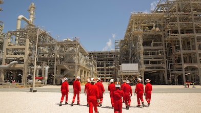 Shell employees walking at the Pearl GTL facility
