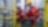 Two workers wearing hard hats discussing inside refinery