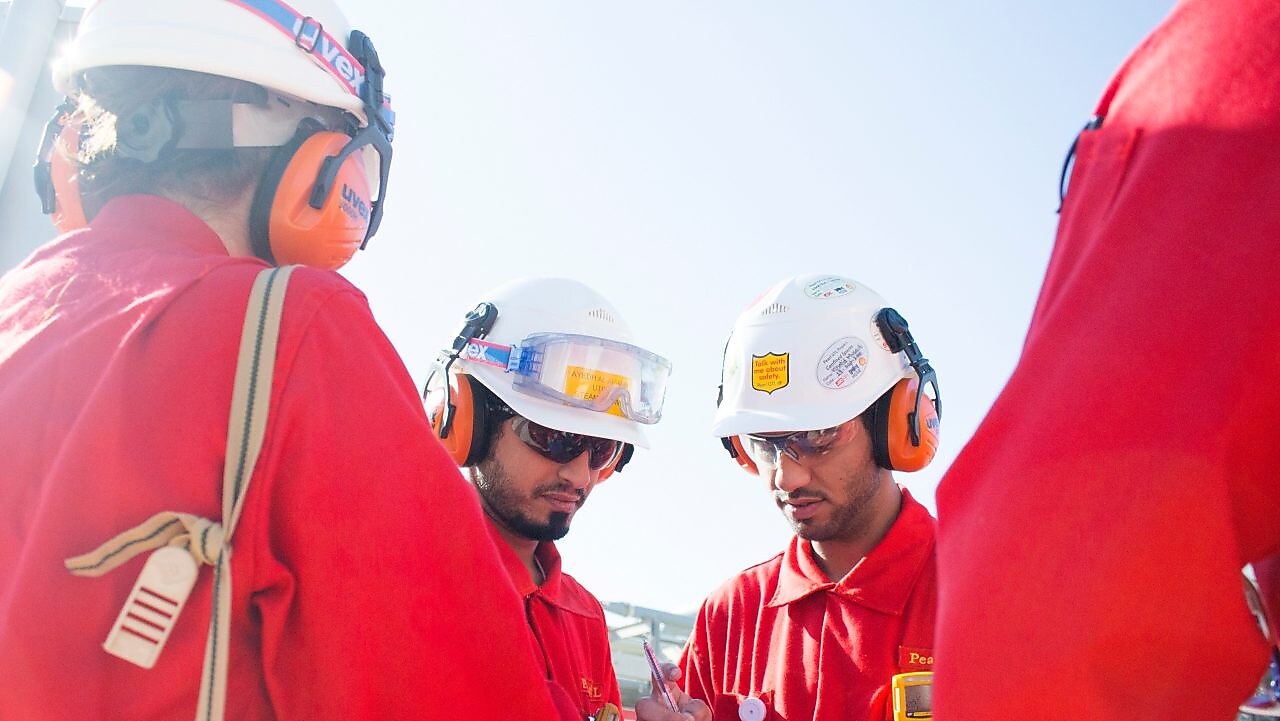 Four engineers are having a conversation