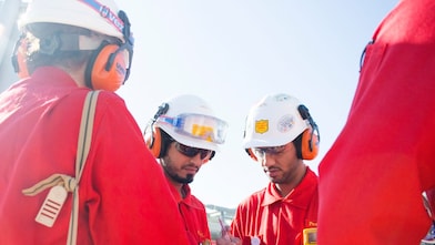 Four engineers are having a conversation