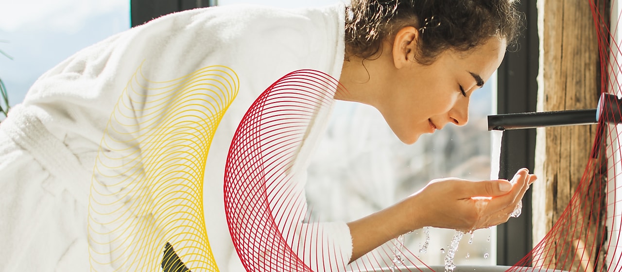 Woman washing her face