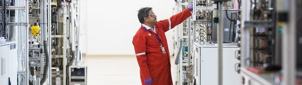 Shell employee checking equipment in plant