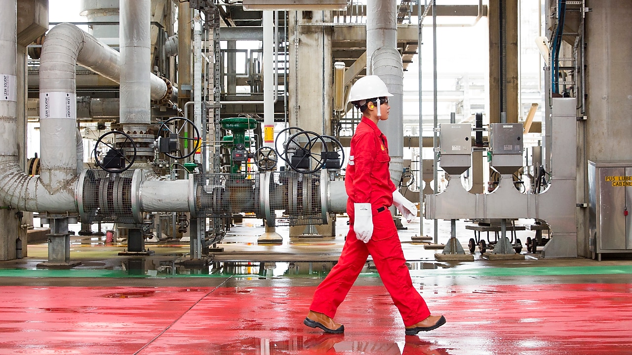 A person is walking on a construction site.