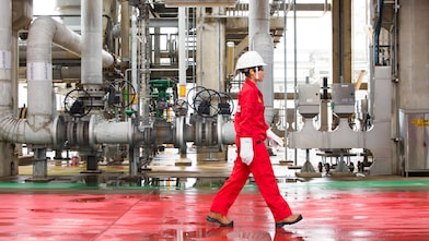 A person is walking on a construction site.