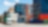 A stack of containers with a truck passing by