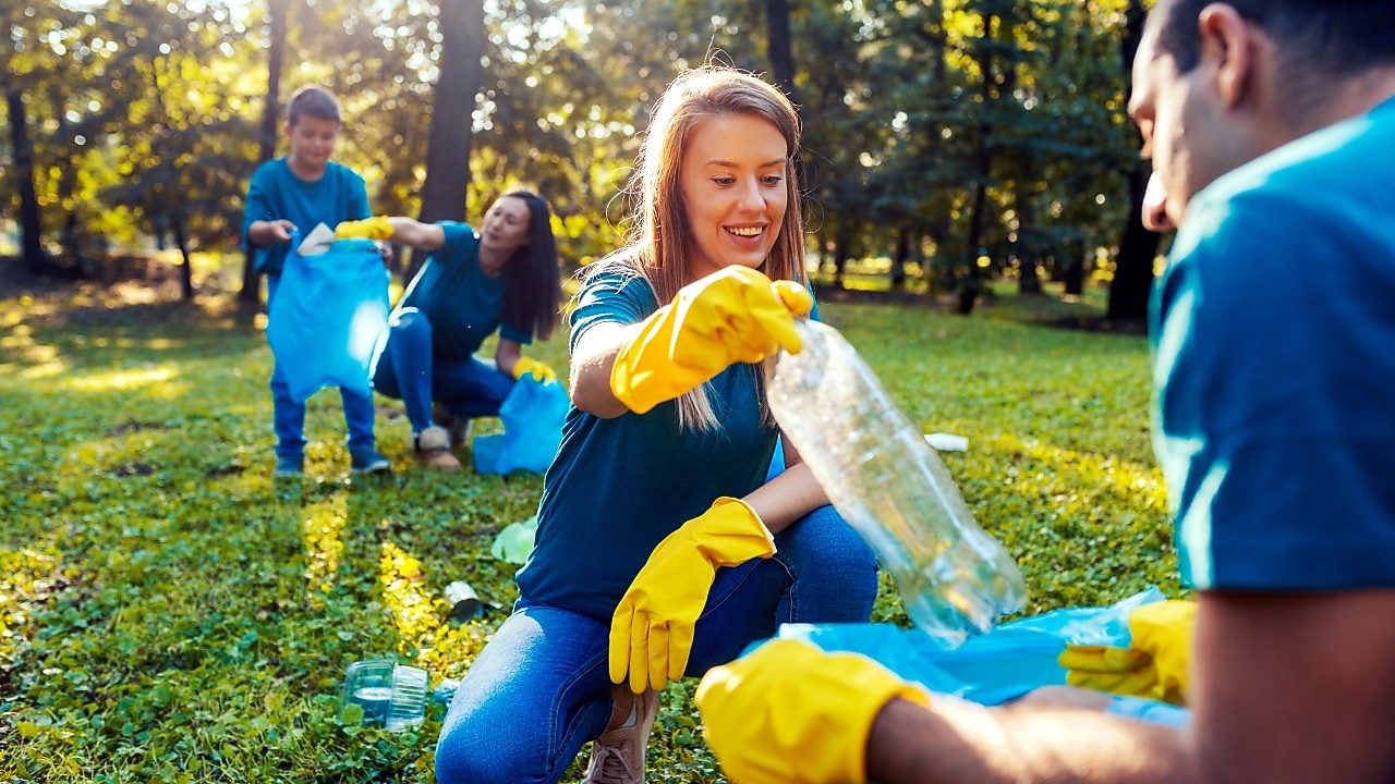 Young people collecting waste
