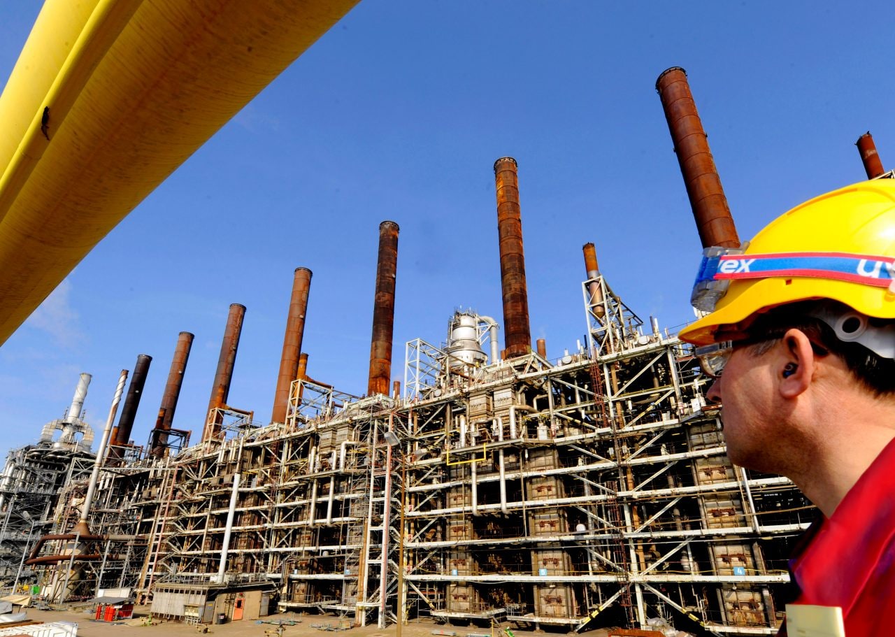 Man watching refinery plant