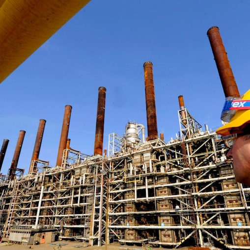 Man watching refinery plant