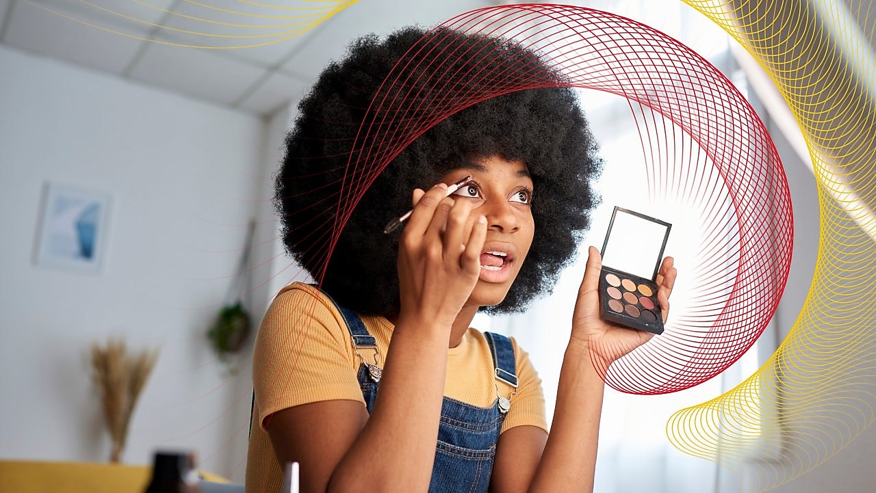 a lady putting makeup on