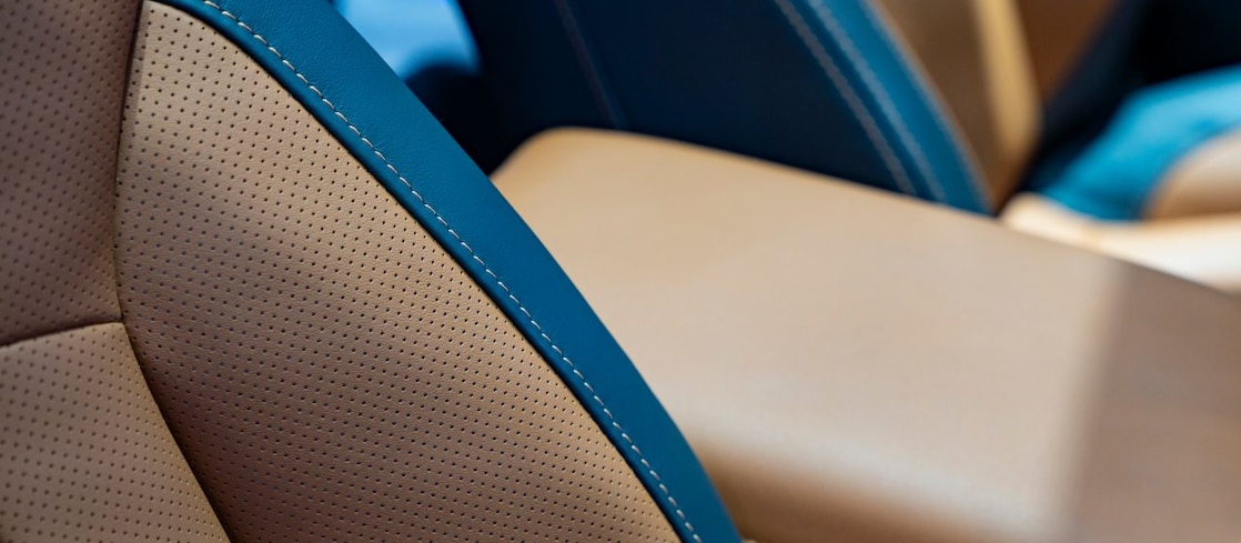 A close up of of a leather car seat