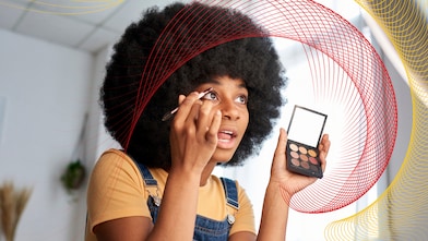 a lady putting makeup
