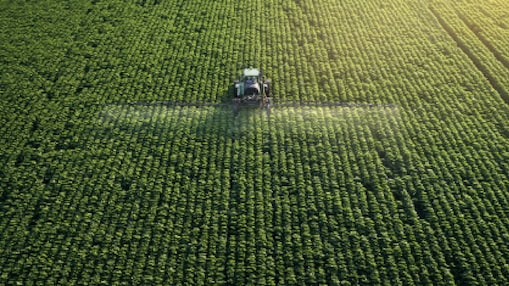 A machine spraying chemicals in the field.