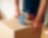 Man using packing tape made sticky with Shell Chemicals