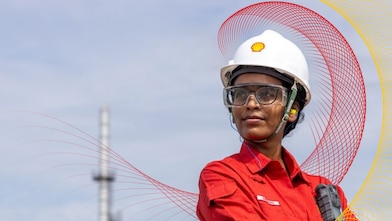 a woman with a Shell Chemicals helmet