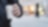 Man holding a styrene cup of hot drink walking on a street