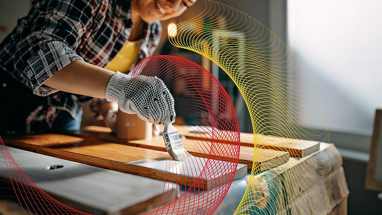 A woman painting with a brush