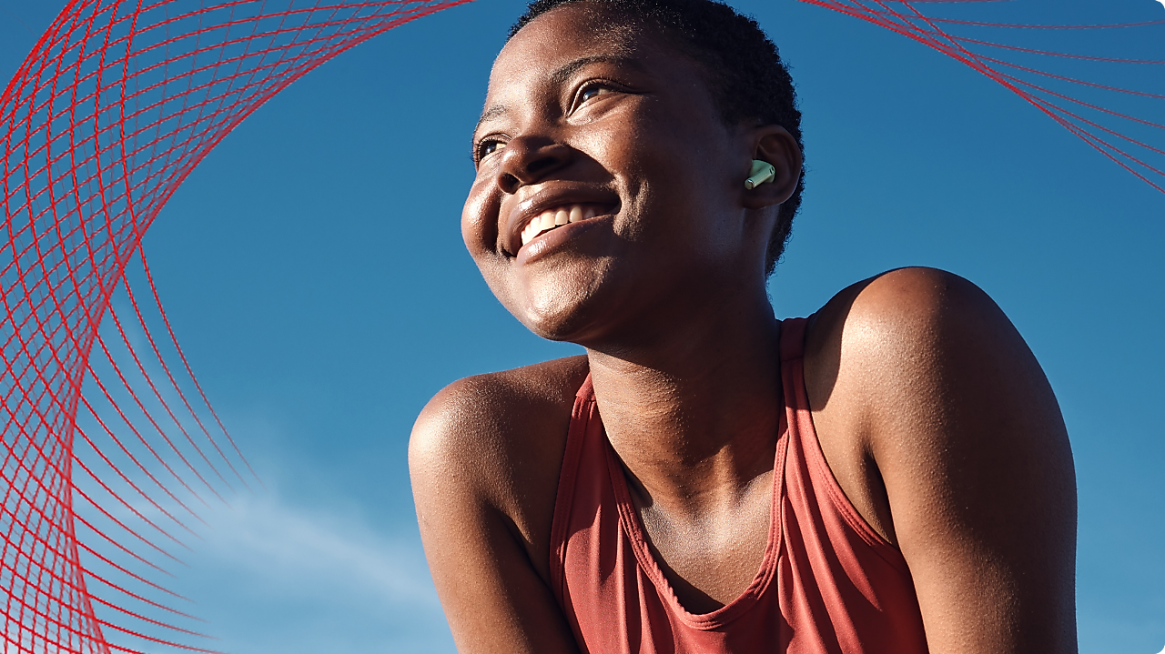 Smiling woman in front of blue skies