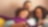 Smiling family sitting on couch