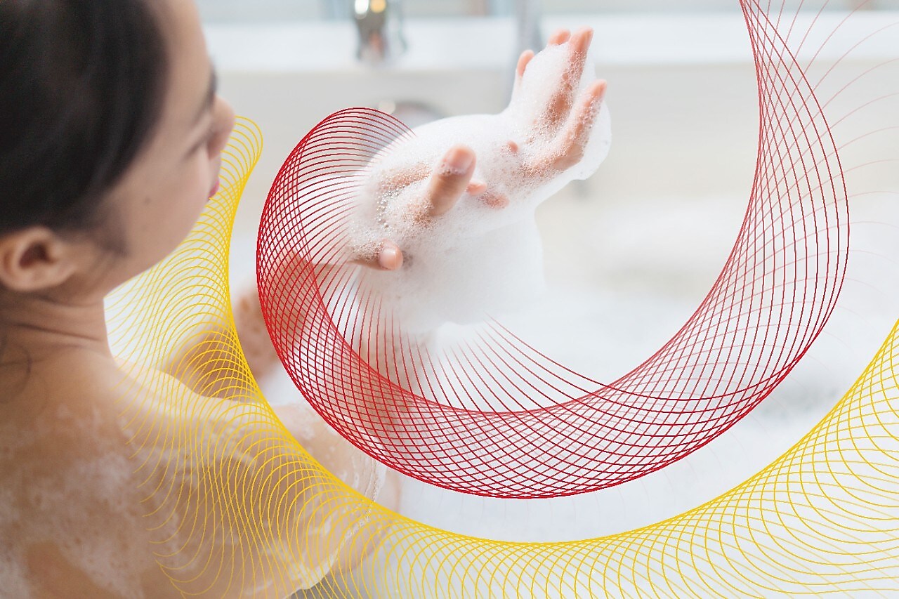 a woman in the tub with the suds