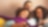 Smiling family sitting on couch