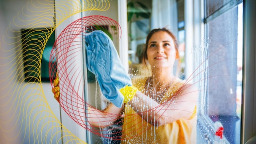 Woman cleaning the glass