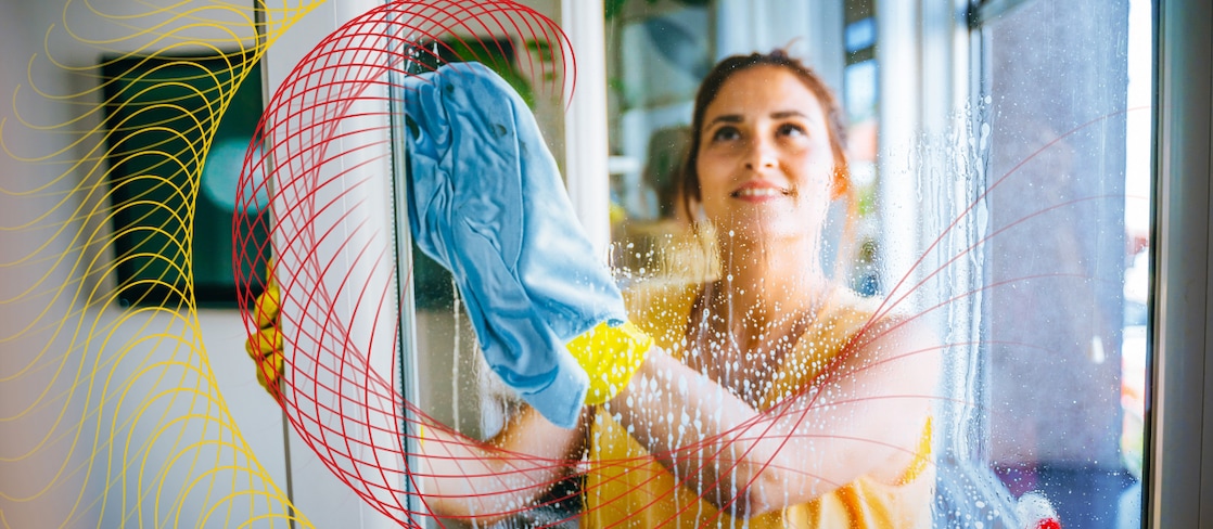 Person cleaning a window with a cloth