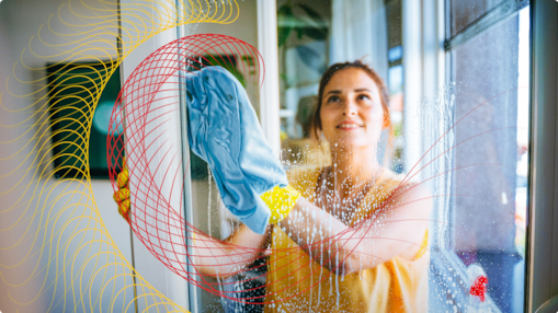 Person cleaning a window with a cloth