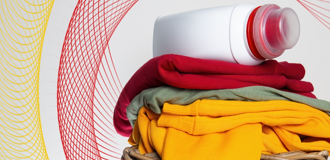 Detergent bottle on folded clothes
