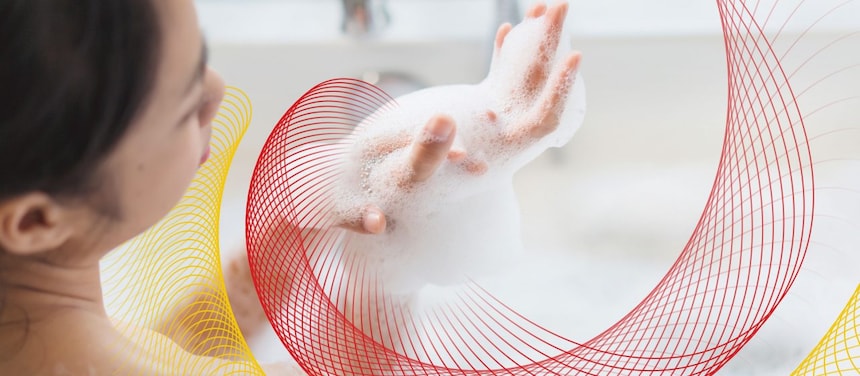 a woman in the tub with the suds