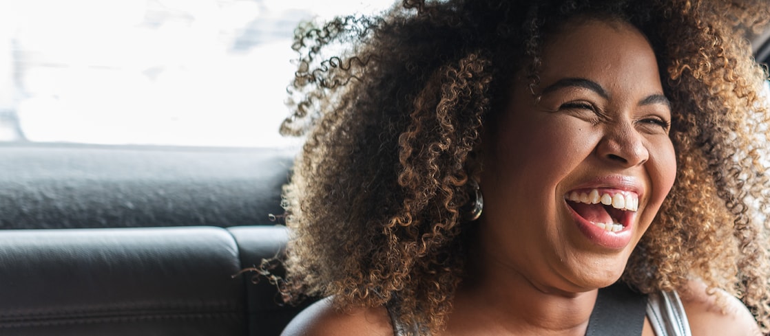 Smiling woman in backseat