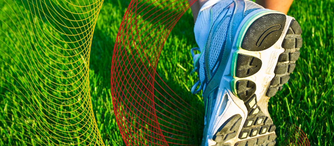 Shoe bottom over field of grass 