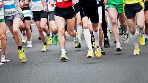 group of people running in sneakers 