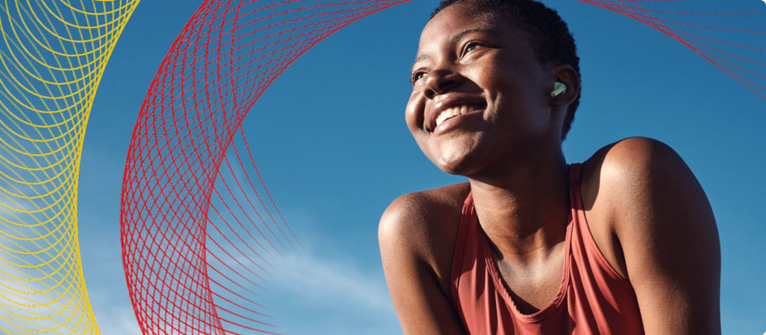 Smiling woman in front of blue skies