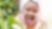 Woman washing her face outdoors in a robe