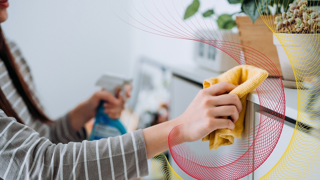 Person cleaning with a cloth