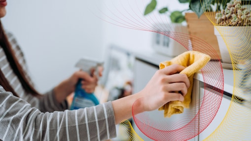 Person cleaning with a cloth