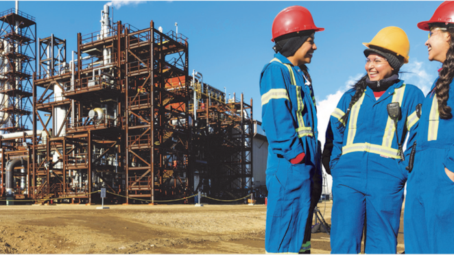 Industrial facility with workers in protective gear
