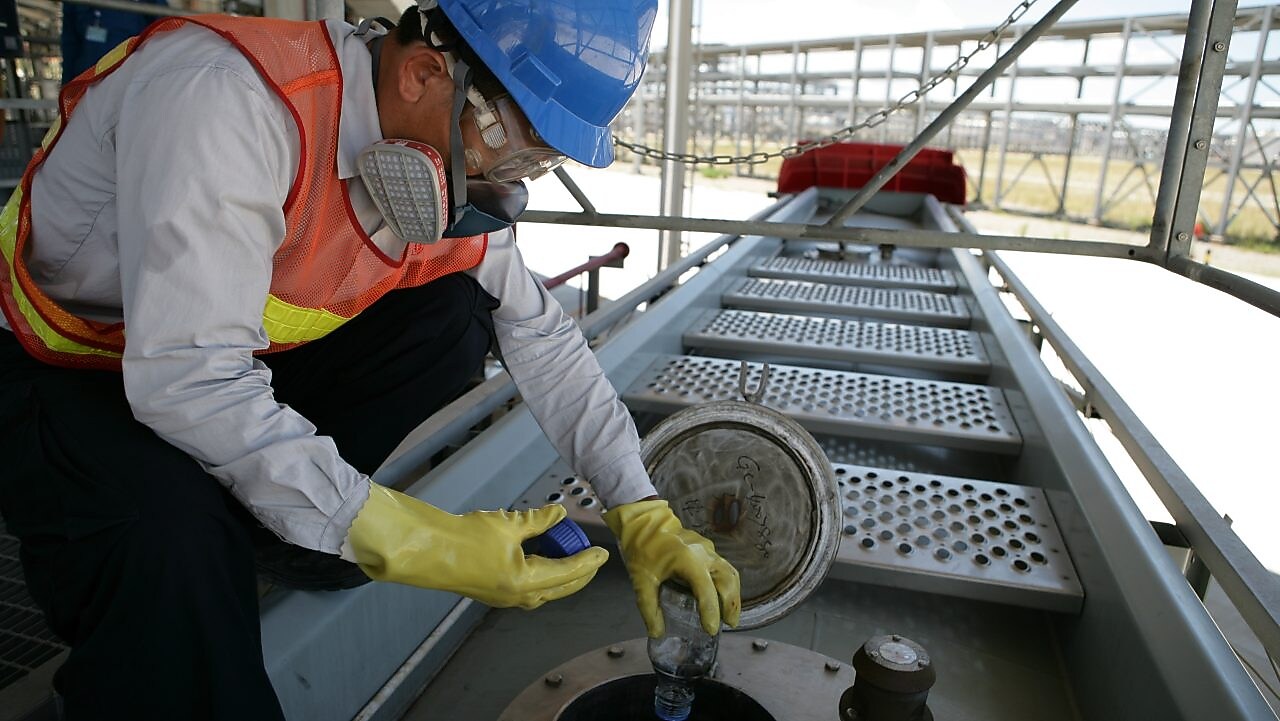Chemicals Nanhai Chemicals Plant - Staff loading liquid products to truck