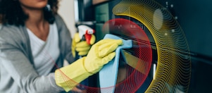 A woman cleaning the kitchen