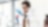 Woman scientist studying conical flask