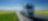 Lorry driving on a road next to a rapeseed field