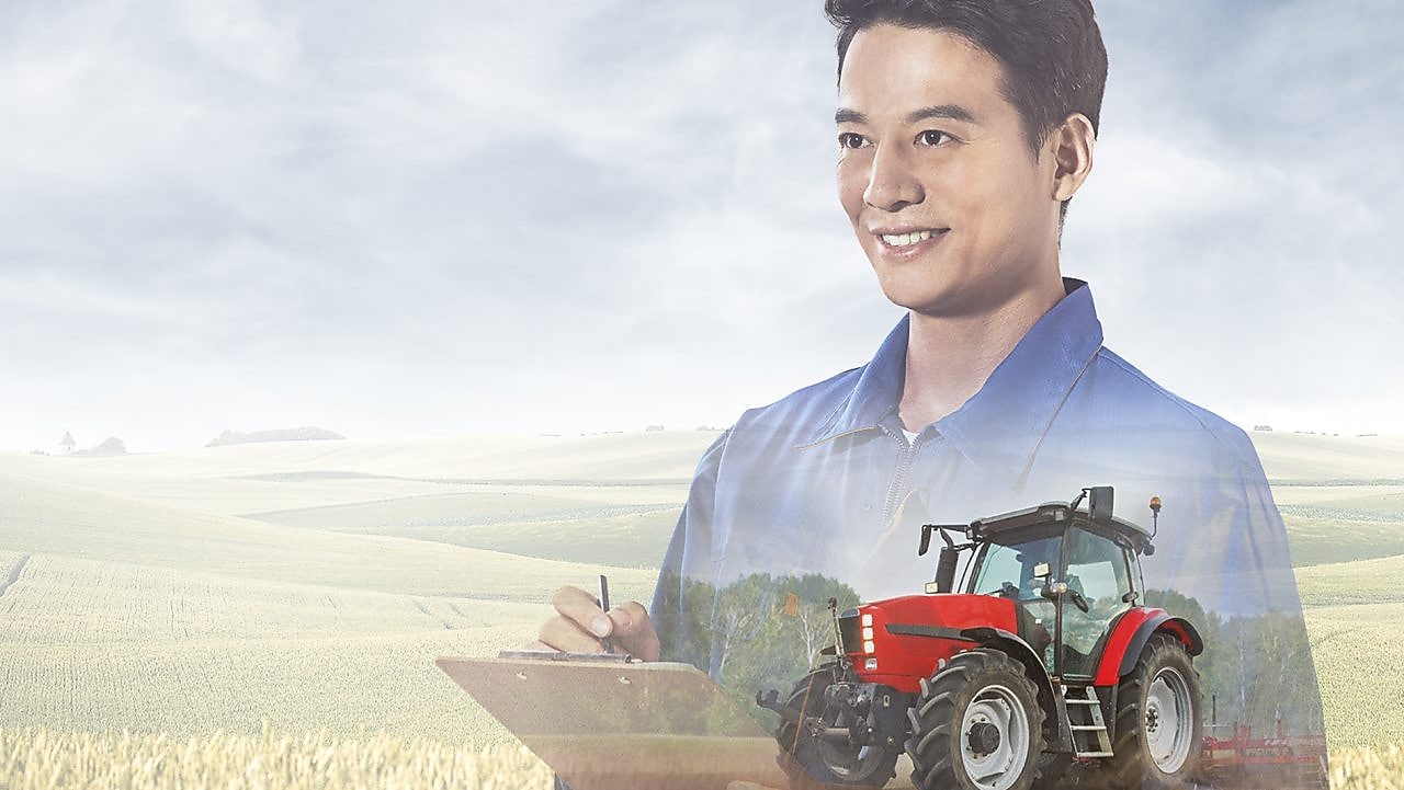   Two farmers reviewing information on tablet